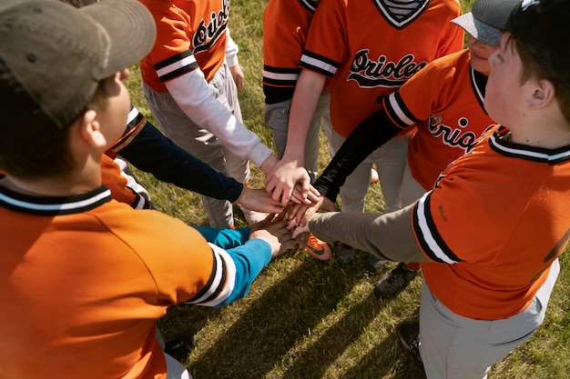 High angle kids putting hands together