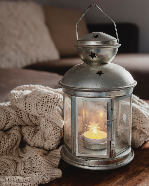 High angle lamp with candle and blanket