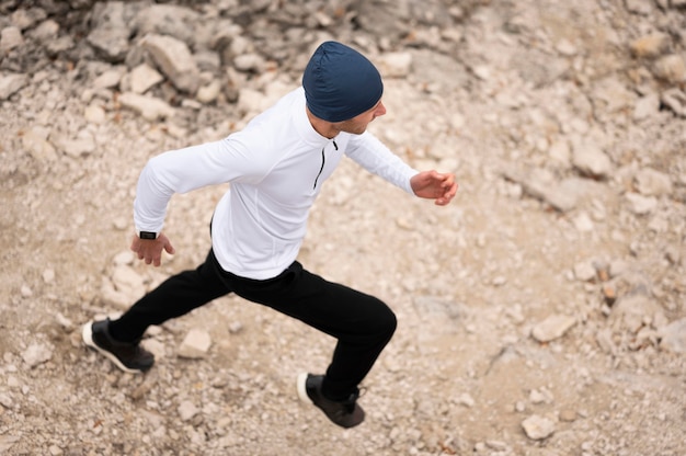 High angle man running on trail