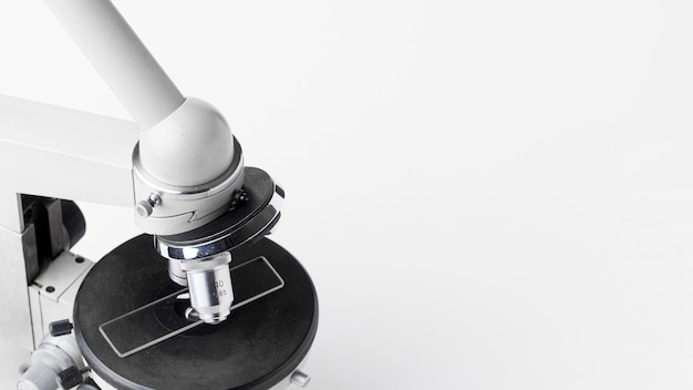 High angle microscope on white background with copy space