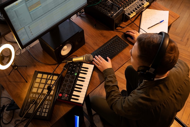 Photo high angle musician working in studio