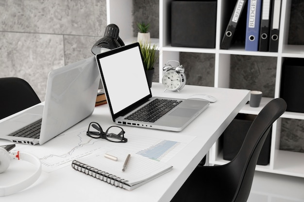 high angle of office workspace with laptops