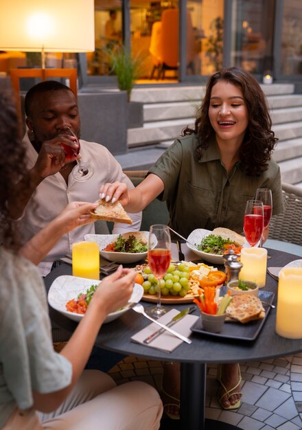 High angle people enyoing a dinner party