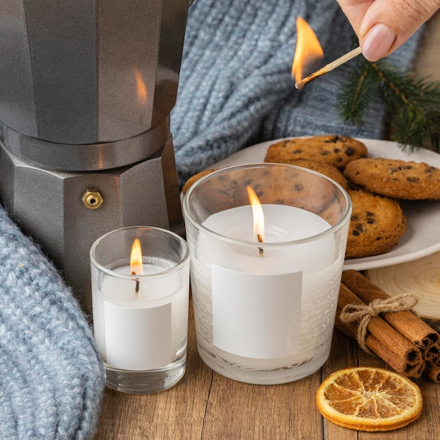 High angle of person lighting candles with match