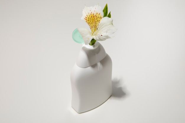 High angle plastic bottle with flower