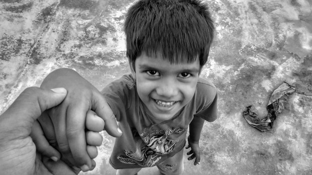 Photo high angle portrait of boy standing on land