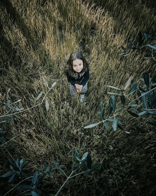 High angle portrait of child on field