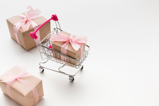 high angle of shopping cart with presents