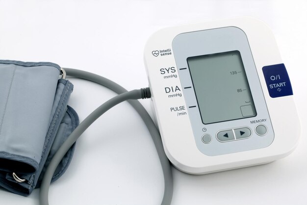 High angle shot of a digital blood pressure machine isolated on white background