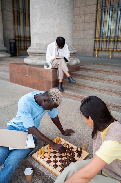 High angle students playing chess