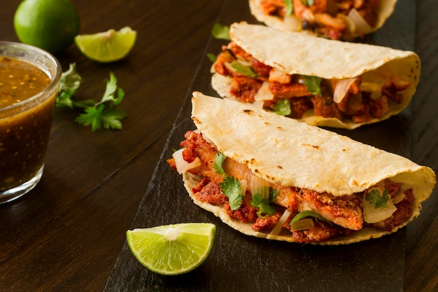 High angle tacos on wooden background