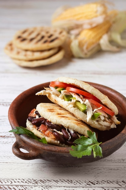 Photo high angle tasty arepas with vegetables