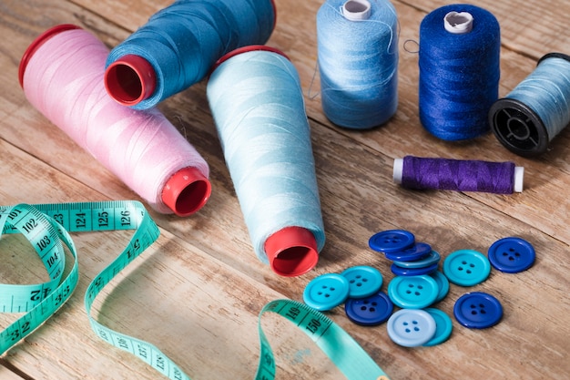 High angle of thread reels with buttons and measuring tape