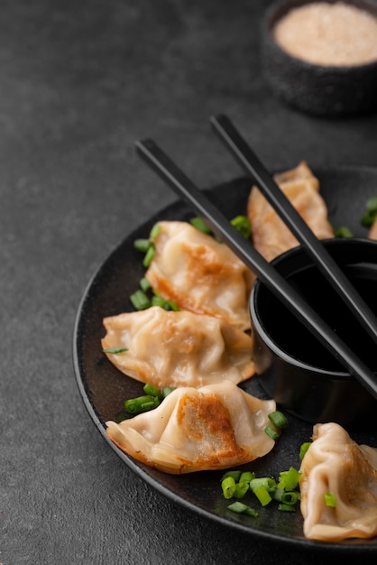 High angle of traditional asian dish with dumplings on plate