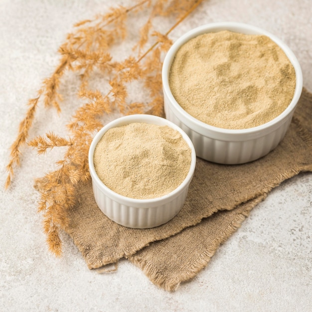 High angle of two bowls with fine powder