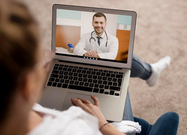 high angle video call on laptop with doctor
