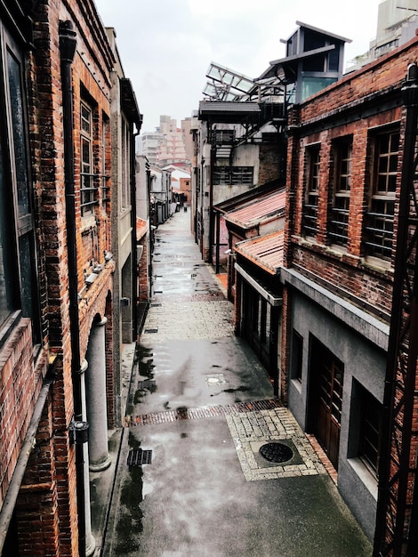 High angle view of alley amidst buildings in city