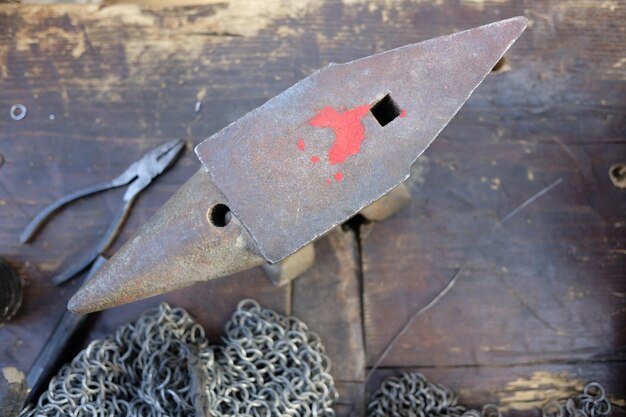 High angle view of anvil on table