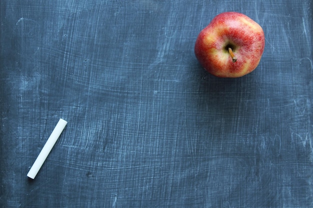 High angle view of apple on blackboard