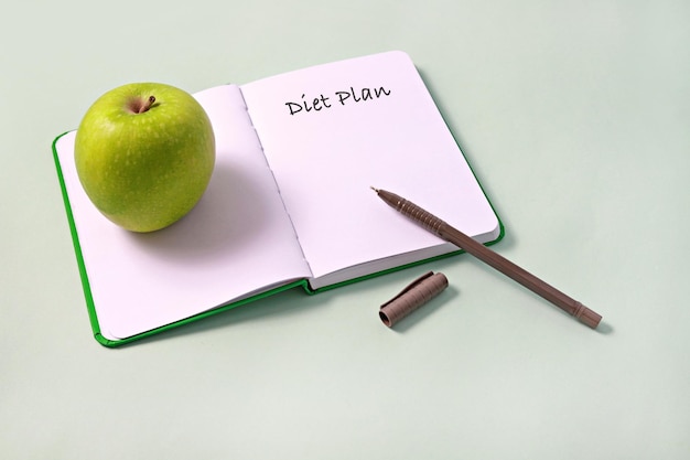 High angle view of apple on table against white background