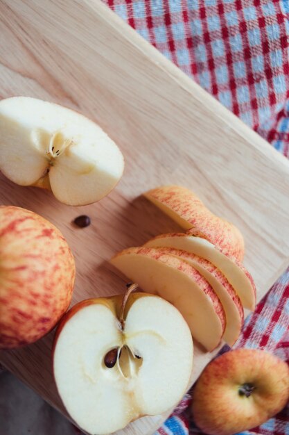 High angle view of apples on cutting board on table