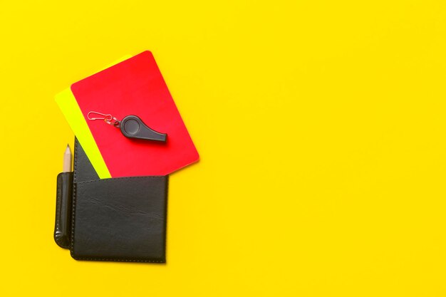 High angle view of arrow symbol on yellow paper