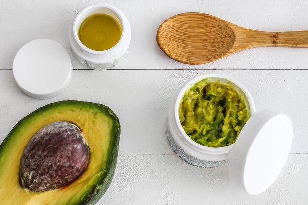 High angle view of avocado and oil on table