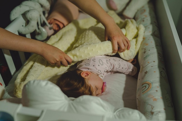 high angle view of baby girl lying on bed at home