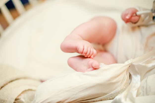 High angle view of baby girl sleeping on bed at home