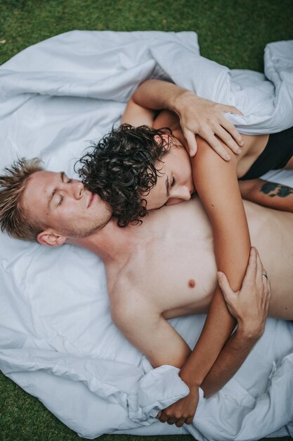 High angle view of baby lying on bed