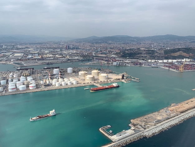 High angle view of barcelona port by sea against sky