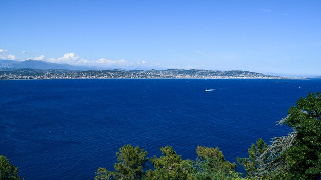 High angle view of bay against clear blue sky