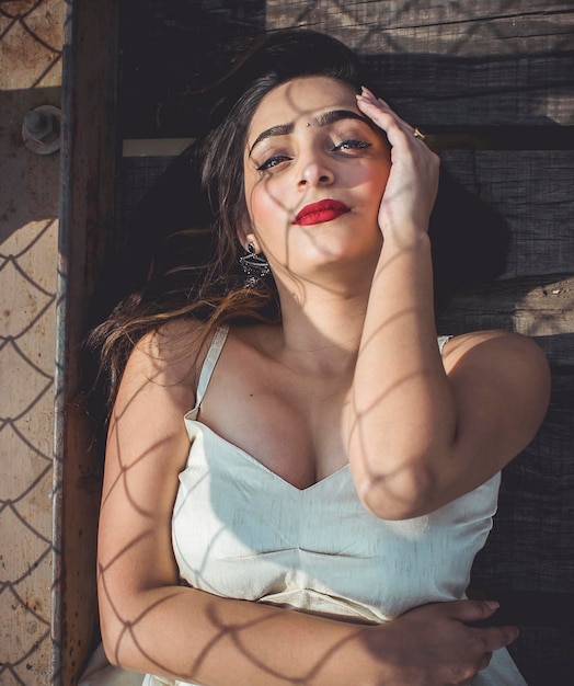 High angle view beautiful woman lying down on footbridge