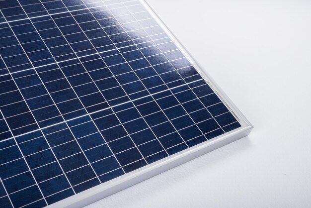 High angle view of blue solar panel isolated over white background, copy space. solar energy, electricity, green technology and sustainability concept