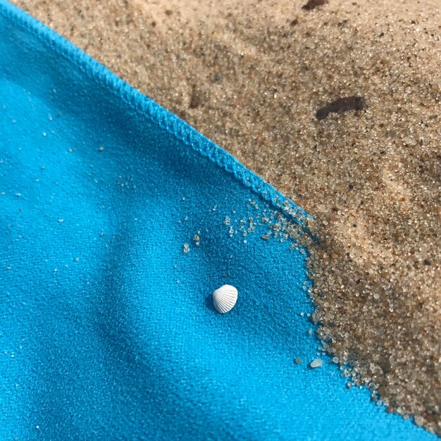 High angle view of blue water on sand