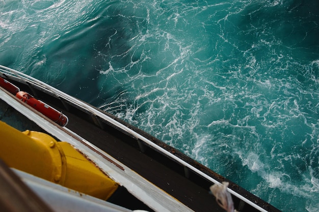 High angle view of boat sailing in sea