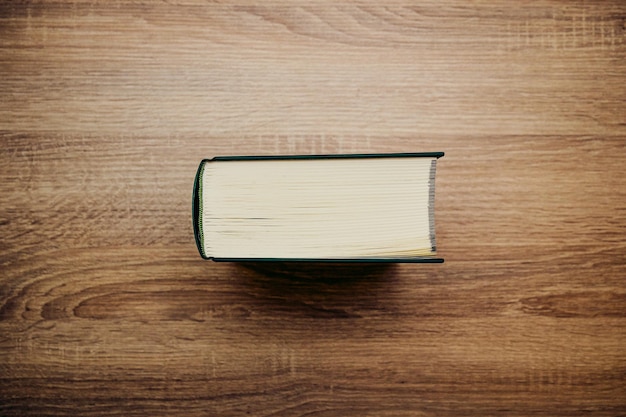 High angle view of book on wooden table