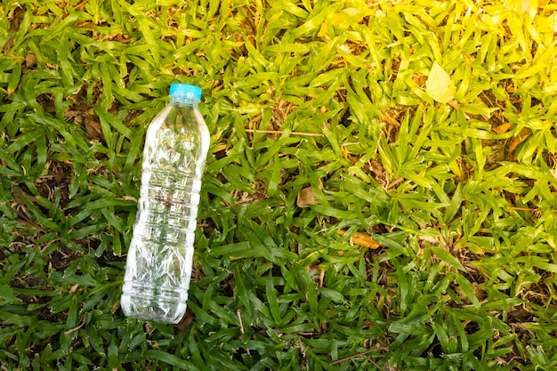 High angle view of bottle on green grass
