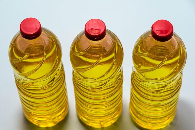 High angle view of bottles on table against white background