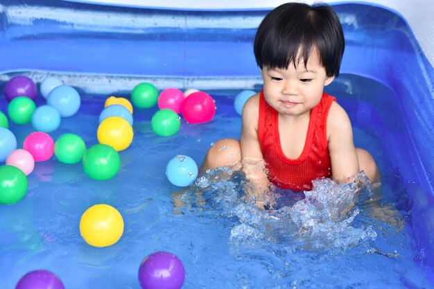 High angle view of boy playing with balloons