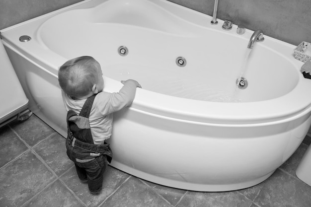 High angle view of boy standing in bathroom