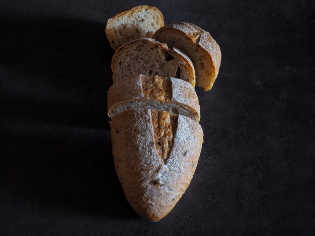 Photo high angle view of bread on table against black background