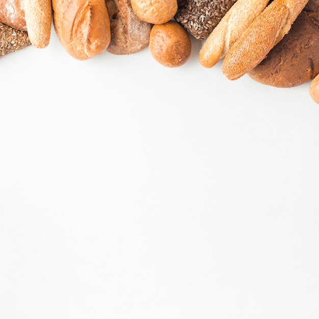 High angle view of breads at the top of white background