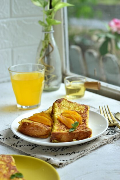 High angle view of breakfast served on table beside the window