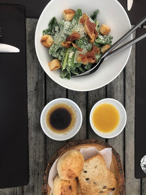 Photo high angle view of breakfast served on table