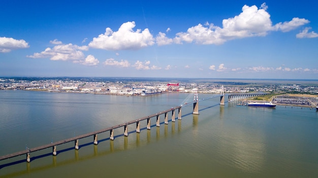 High angle view of bridge over river against sky in city