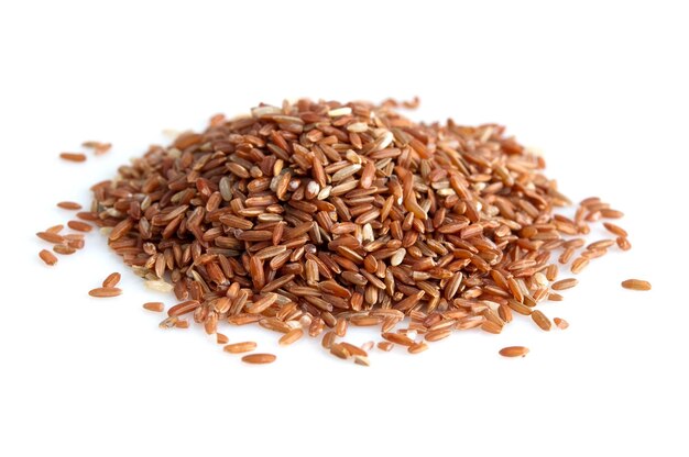 High angle view of brown rice on white background