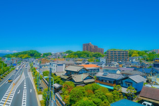 High angle view of buildings against clear blue sky