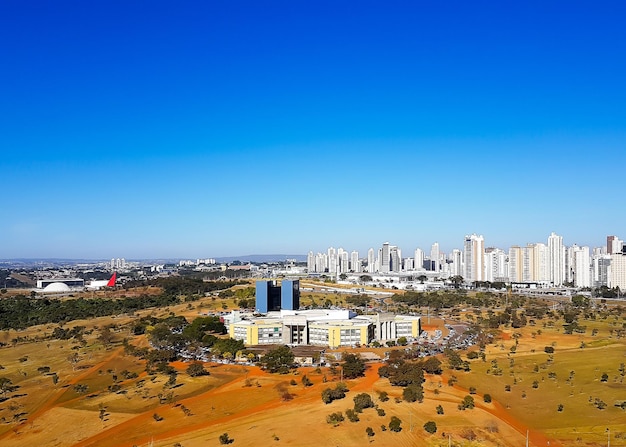 High angle view of buildings against clear blue sky