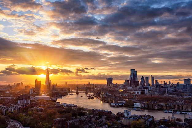 Photo high angle view of buildings against cloudy sky during sunset